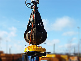 Material handler with load lifting magnet